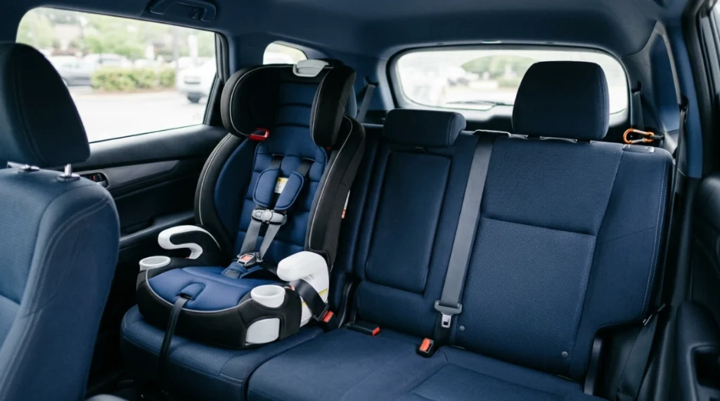 Britax Grow With You ClickTight harness booster car seat installed on a rear SUV bench