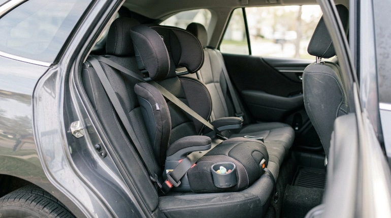 KidFit ClearTex Plus booster showing adjustable headrest, LATCH, padding and compact seat design